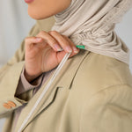 Model wearing Ashwood Ruching Lite, showcasing the neutral tone styled to show ruching detail.