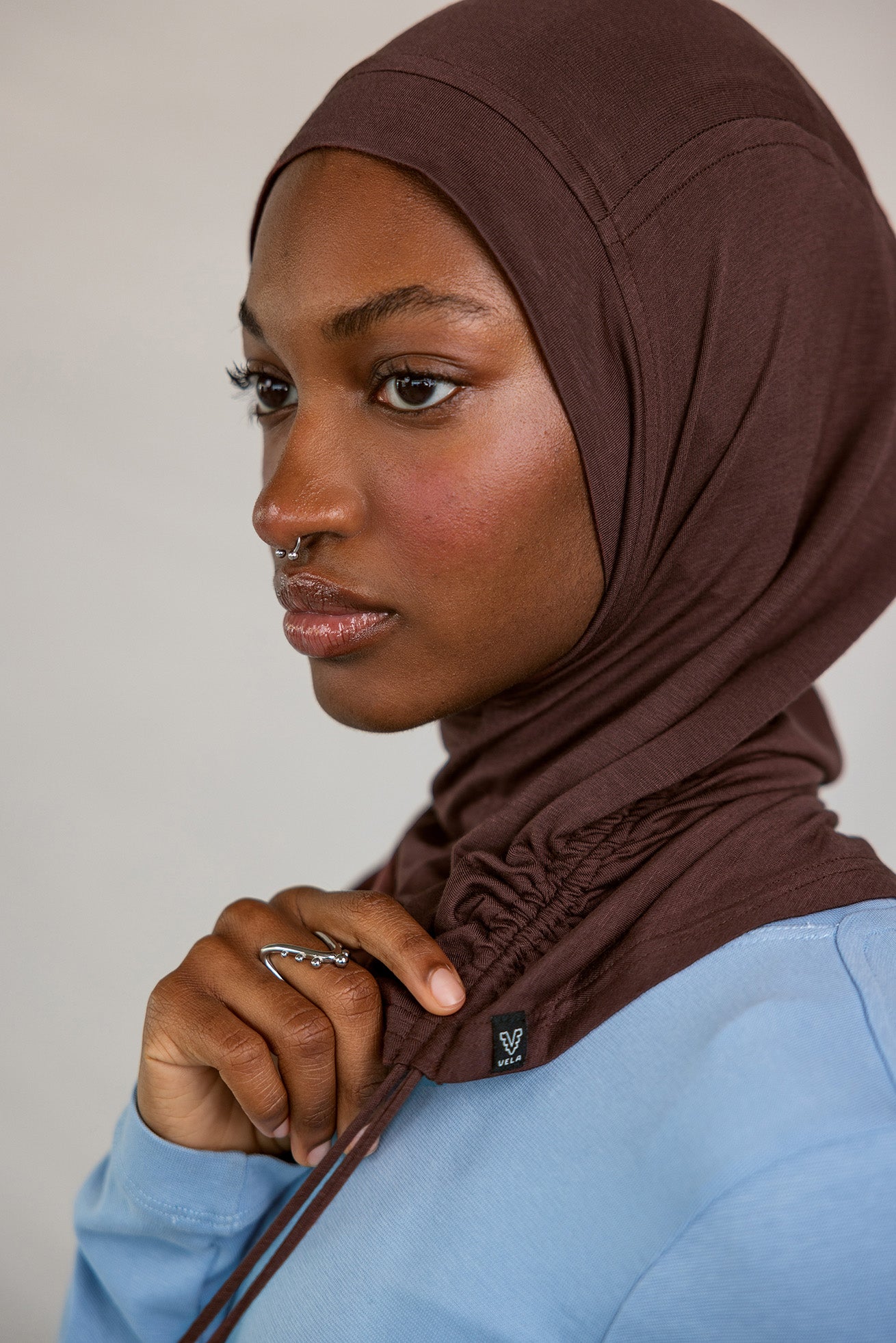 Model wearing Espresso Ruching Lite, highlighting rich brown hue and ruching texture.