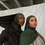 Two models wearing Hunter Green Jersey Lite, both in a front-facing pose, highlighting its deep, rich green color.