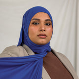 Model wearing Ocean Blue Jersey Lite in a casual wrap style, showing off its breathable, wrinkle-resistant fabric.