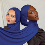Two models wearing Ocean Blue Jersey Lite, displaying its deep, saturated blue in different angles.