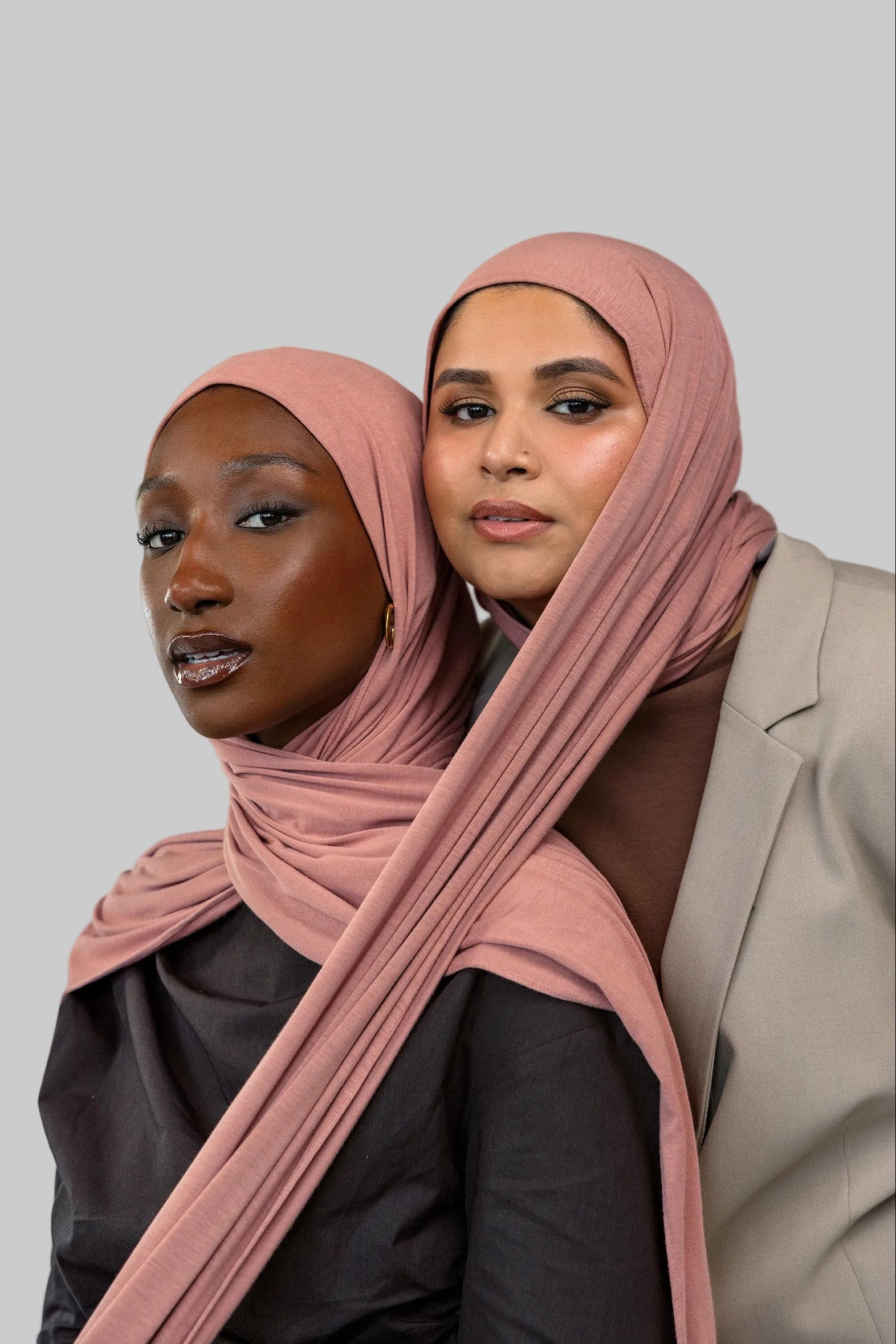 Two models wearing Terra Blush Jersey Lite showing versatility of the warm pink shade.