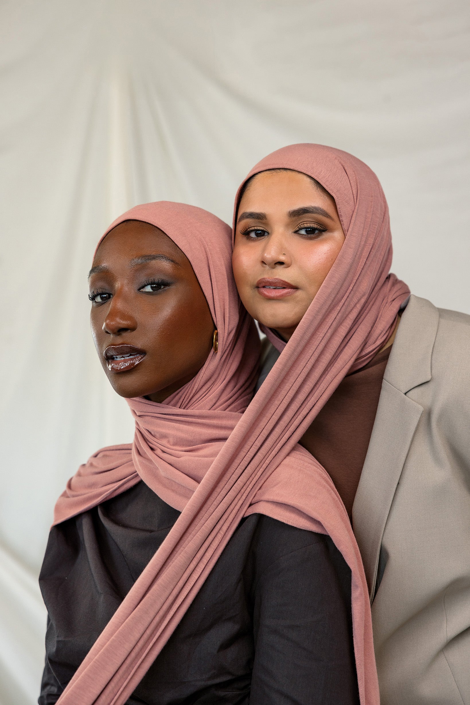 Two models wearing Terra Blush Jersey Lite showing versatility of the warm pink shade.