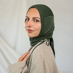 Model wearing Hunter Green Ruching Lite, displaying the ruched detailing and wrinkle-resistant fabric.