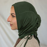 Model wearing Hunter Green Ruching Lite, highlighting ruching effect and deep green shade.