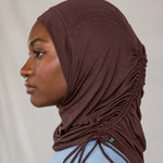 Model wearing Espresso Ruching Lite highlighting the ruched detail from the side profile. 