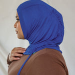 Model wearing Ocean Blue Ruching Lite, displaying depth of blue and ruching detail from different angles.