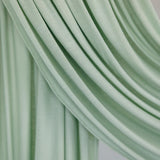 Sage Mist Jersey Lite fabric swatch draped against white backdrop, showing minty green color and airy, soft weave.
