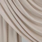  Ashwood Jersey Lite fabric draped in front of white backdrop, revealing beige-ash neutral tone and smooth, breathable texture.