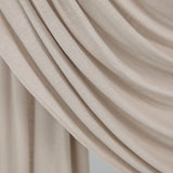  Ashwood Jersey Lite fabric draped in front of white backdrop, revealing beige-ash neutral tone and smooth, breathable texture.