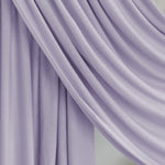 Soft Amethyst Jersey Lite fabric draped smoothly against a white backdrop, showcasing its light lavender hue and soft, airy jersey weave.