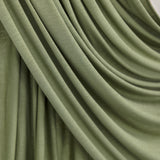 Palm Desert Jersey Lite fabric draped in front of white backdrop, revealing olive tone and airy jersey weave.