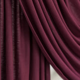 Antique Cherry Jersey Lite fabric swatch draped against white backdrop, showing rich deep maroon color and smooth, breathable jersey texture.