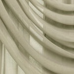 Close-up of draped sheer curtains in a light warm beige or cream tone, showing soft folds and translucent fabric texture.