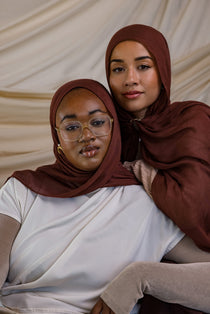Two Models wearing breathable modal hijab inspired by natural spice tones and crafted in small batches.

