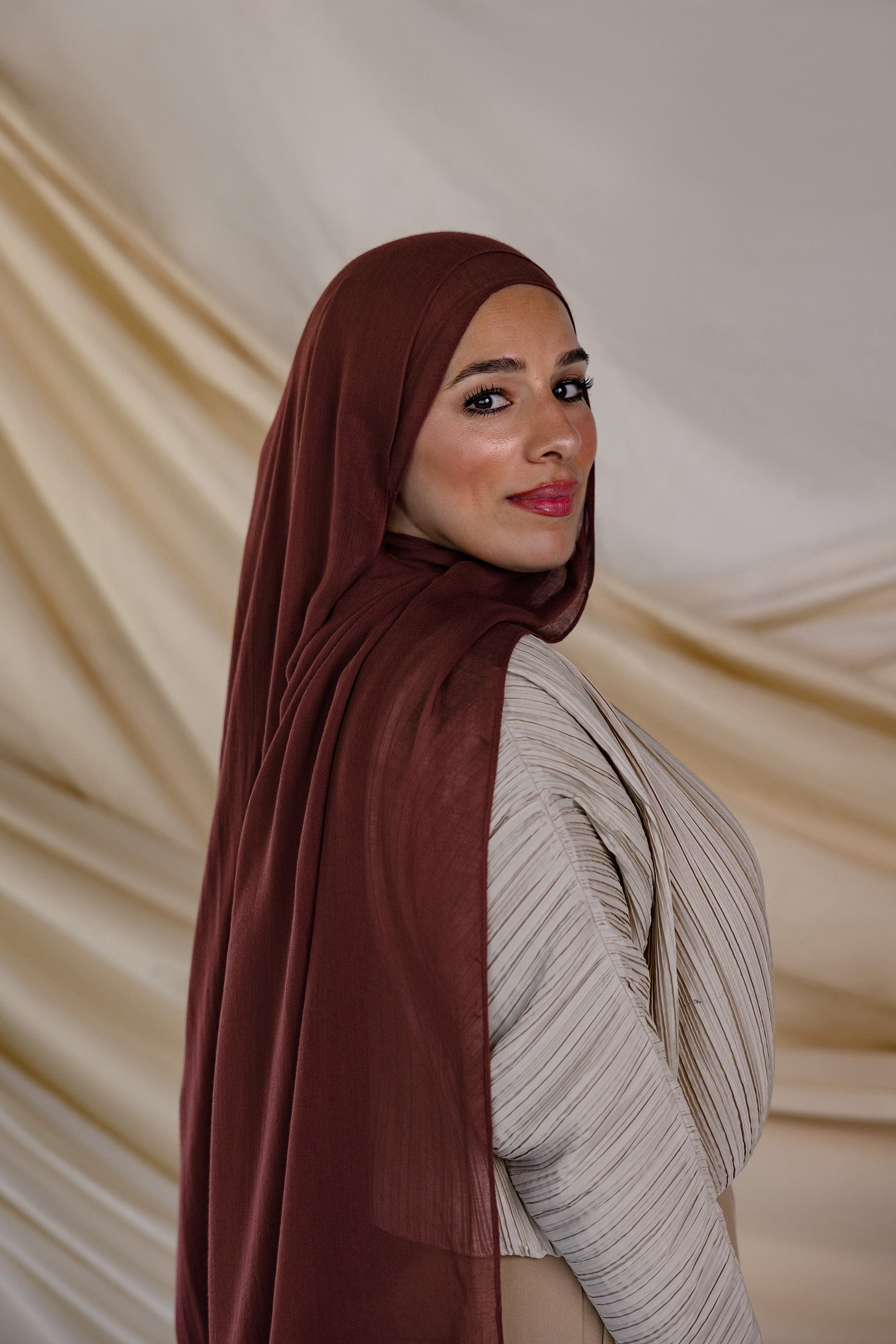 Model wearing hand-dyed modal hijab with earthy inspiration and lightweight feel.


