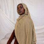 Model shown wearing Sandalwood, an earthy green-brown that has a sand-colored tone. Is a neutral color. 