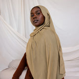 Model shown wearing Sandalwood, an earthy green-brown that has a sand-colored tone. Is a neutral color. 