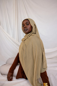 Model shown wearing Sandalwood, an earthy green-brown that has a sand-colored tone. Is a neutral color. 