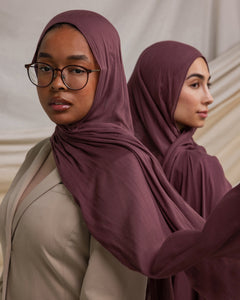 Two models wearing Rosewood hijabs styled against backdrop. 