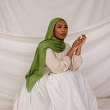 Model in three-quarter pose wearing the Fern Green hijab, emphasizing the fabric’s drape and flow.