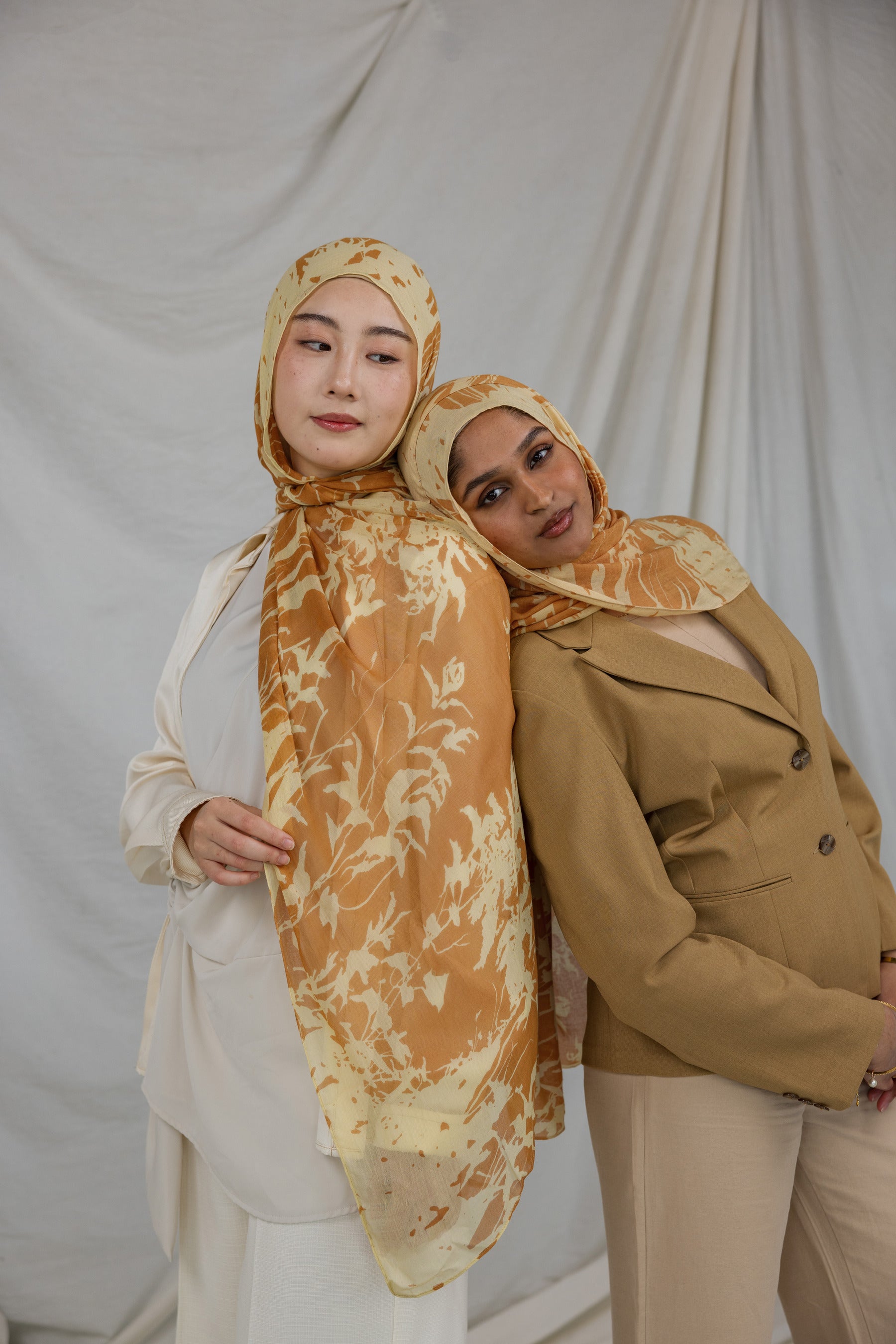 Two Models wearing flowy modal hijab featuring a subtle nature print and all-day comfort.

