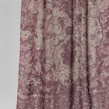 Close-up of hijab fabric with a mauve floral pattern on a white background