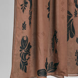 Brown hijab fabric with black floral patterns on a white background