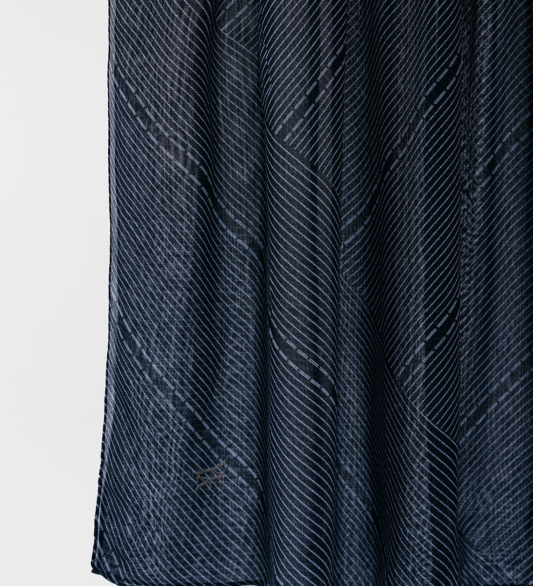 Dark blue textured fabric on a white background
