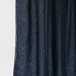 Dark blue textured fabric on a white background