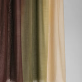Hijab fabric swatch in brown, green, and beige ombre on a plain background