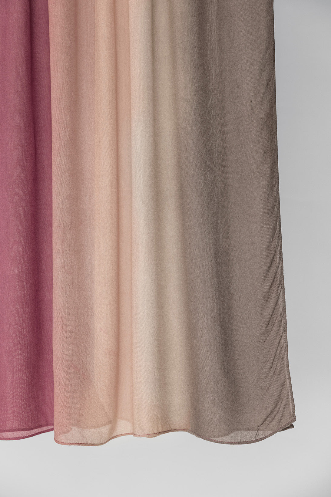 hijab fabric in pink and brown ombre on a white background