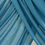 Close-up of bright Storm Blue fabric with draping.