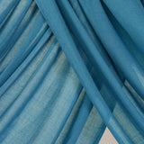 Close-up of bright Storm Blue fabric with draping.