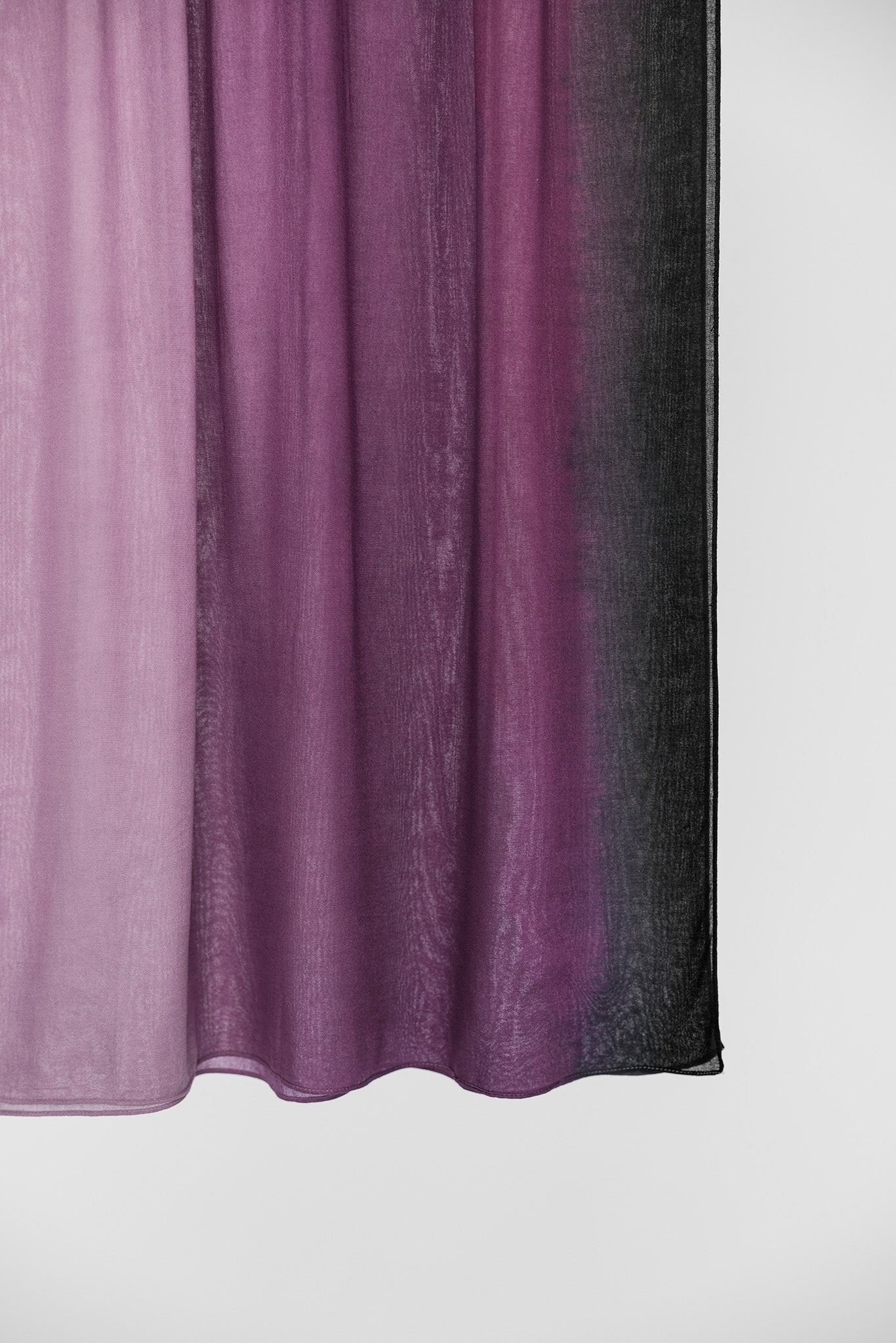 Ombre scarf transitioning from purple to black on a white background