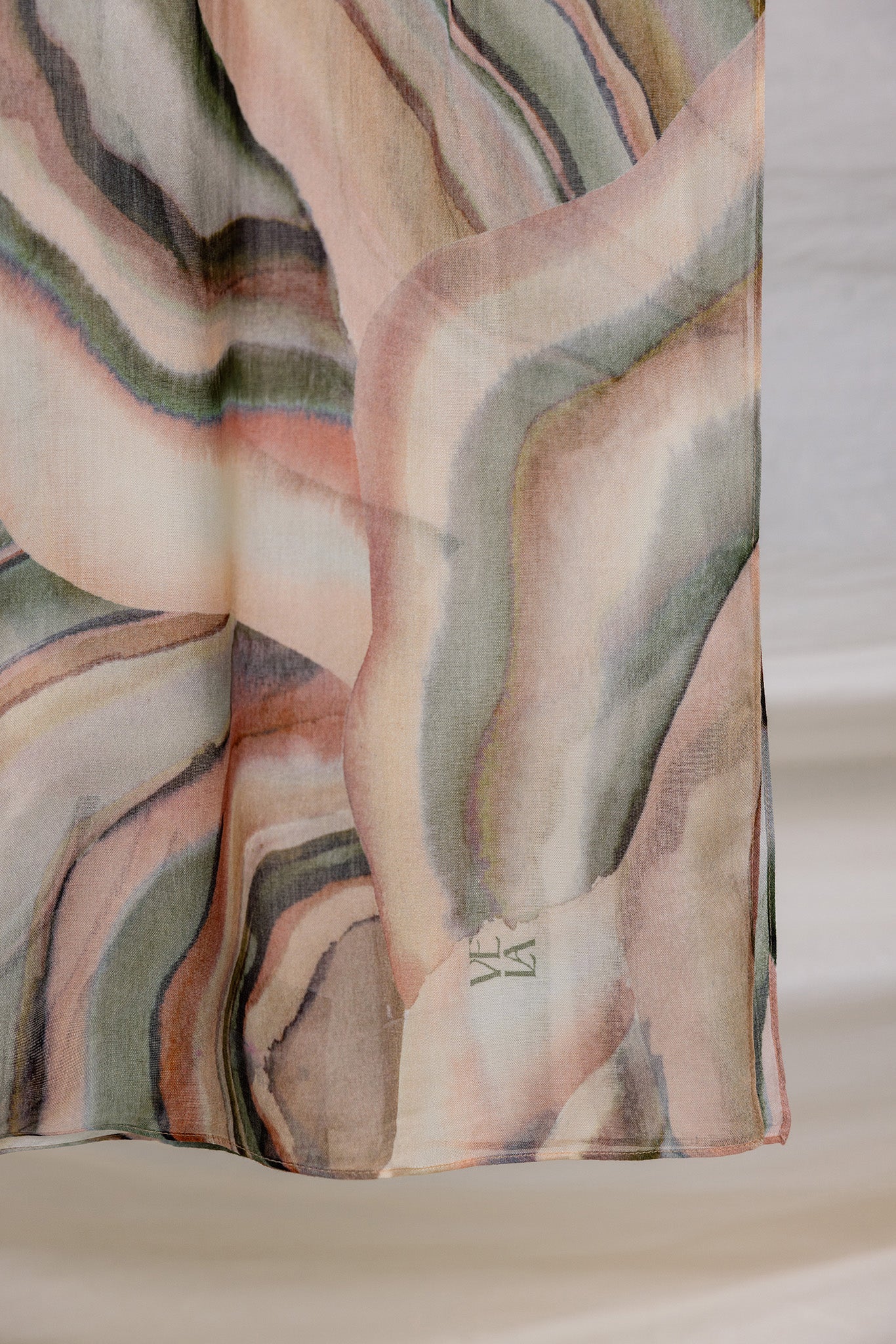 woven modal hijab featuring a colorful sediment design with natural fluidity.
