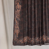 Folded Chocolate Paisley hijab hanging to show print details.