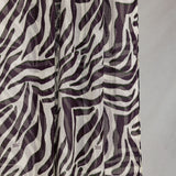 A close-up of the Zebra scarf that shows the scaling and detail of the white base and deep berry stripes. 