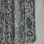 Product shot of Ink Cobra, that displays the snakeskin pattern and white, grey and black tones in the design. 