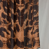 Product shot of Wild Savanna that shows a close-up of the animal-inspired print with peaches/oranges and deep browns. 