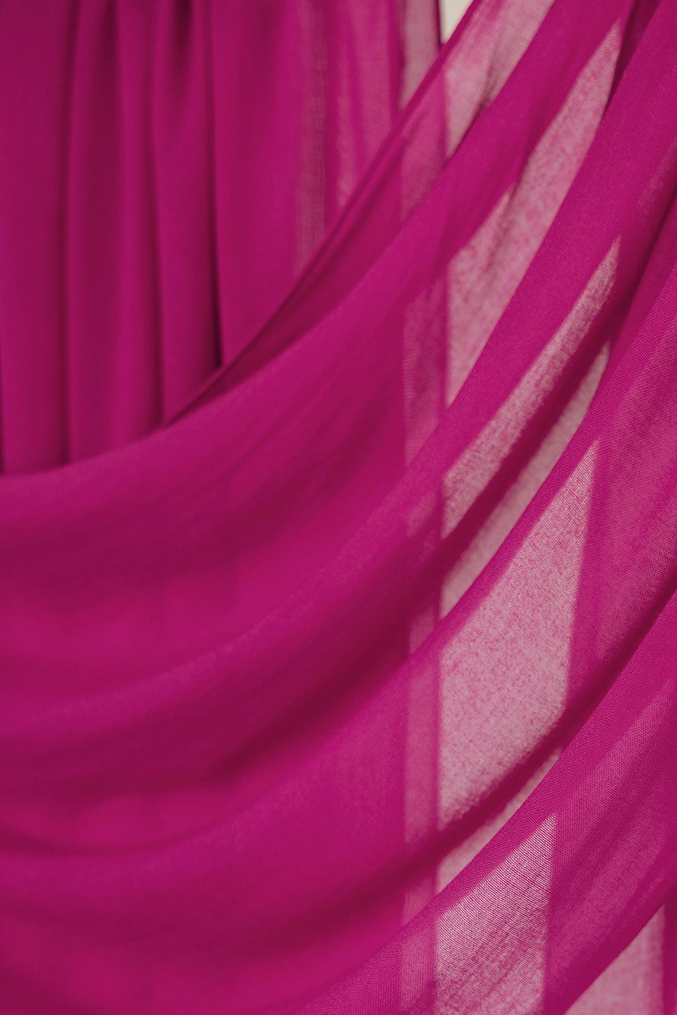 Close-up of pink fabric with a draped effect