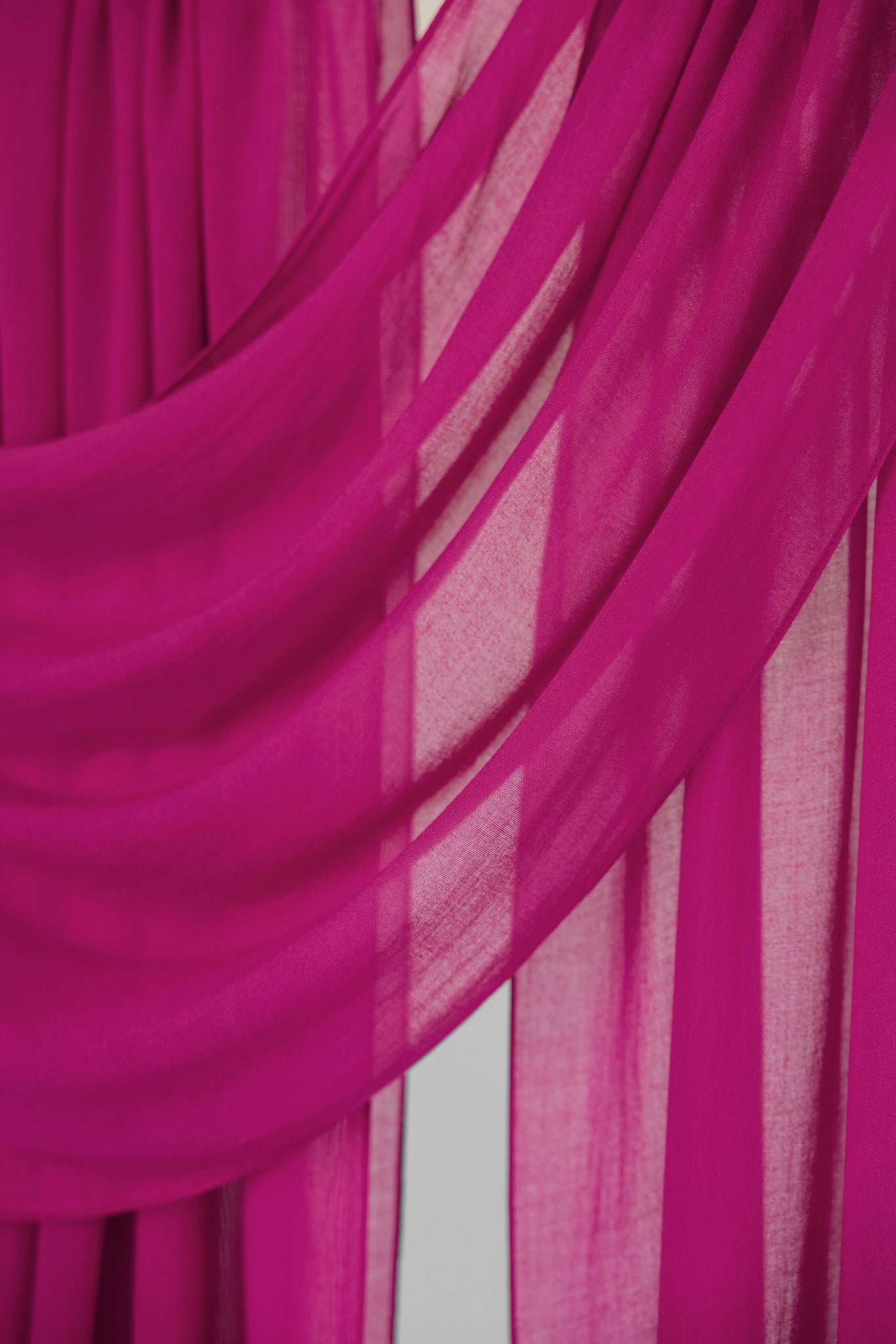 Close-up of pink fabric with a draped effect