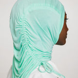 woman wearing sea glass ruching hijab with white top