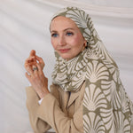 Model wearing Sand Shells patterned hijab against a plain background