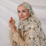 Model wearing Sand Shells patterned hijab against a plain background