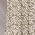 Hijab with shell pattern in beige on a plain background