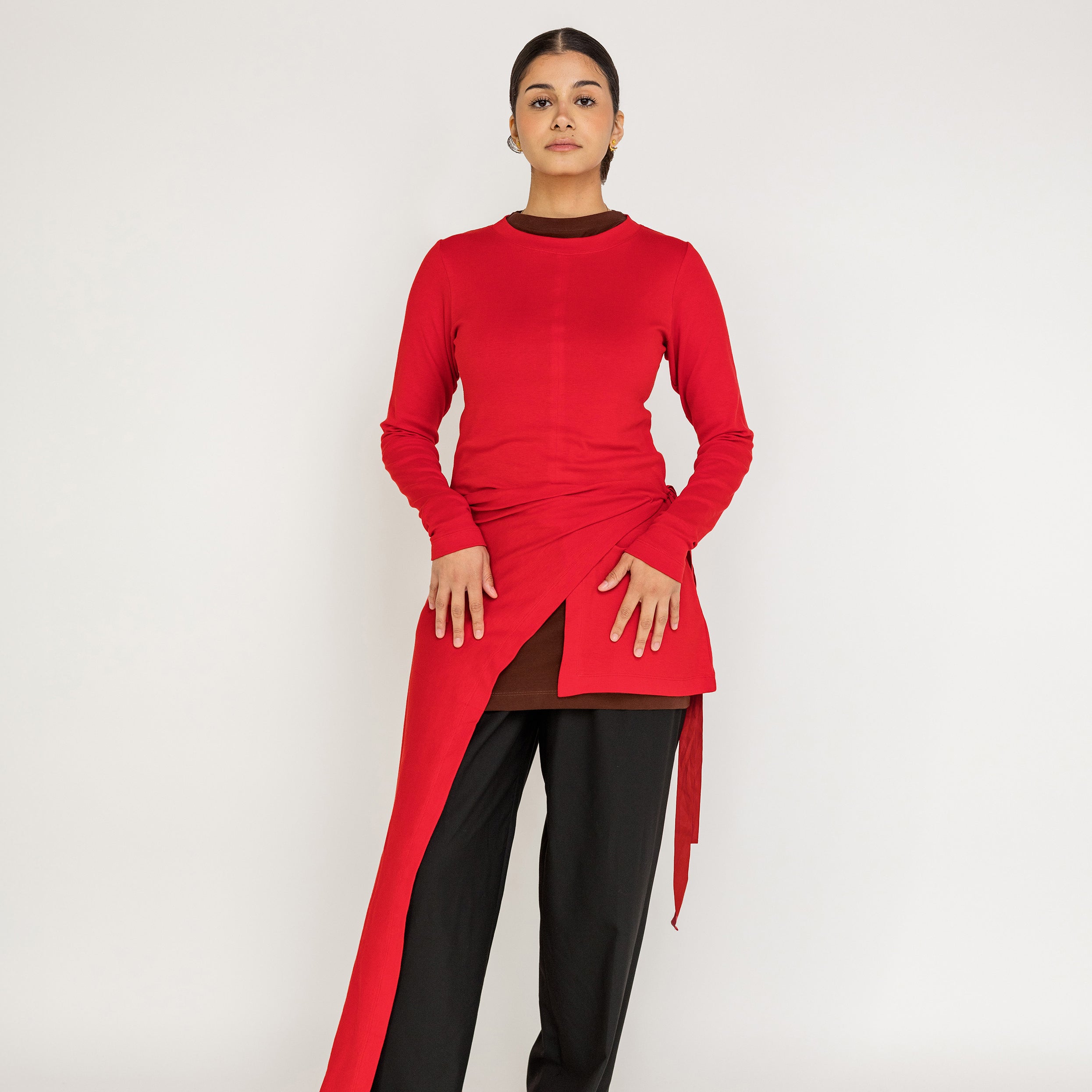 Loose-fit top designed for layering, with a flowing high-low silhouette