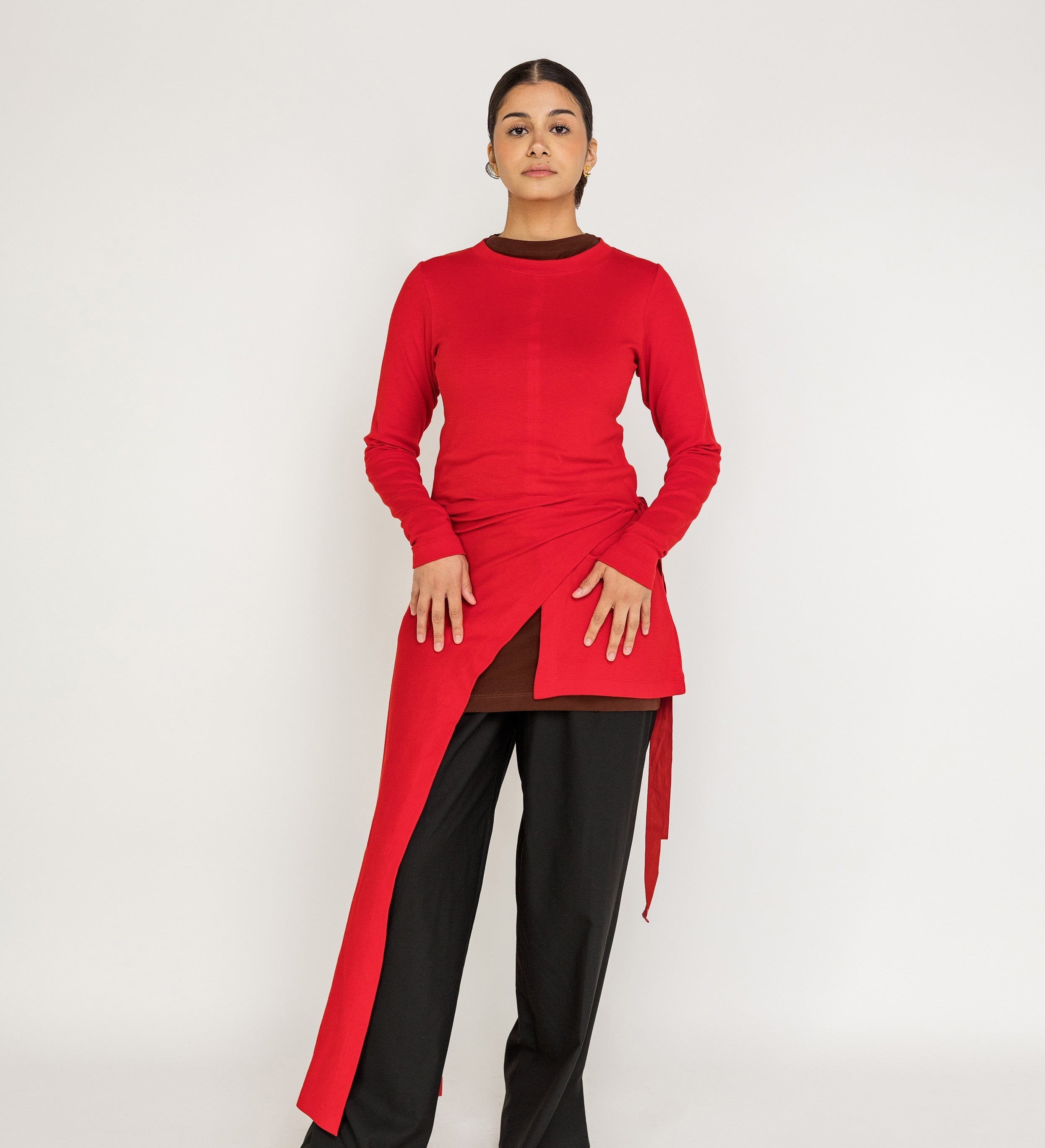 Loose-fit top designed for layering, with a flowing high-low silhouette