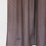 striped brown fabric with a subtle pattern on a white background