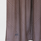 striped brown fabric with a subtle pattern on a white background